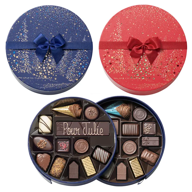 Boite de Noël ronde rouge ou bleue - 25 chocolats assortis et sa barre gourmande